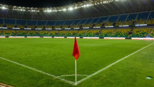 Explore o estádio iluminado de Kigali, exibindo a vibrante cultura esportiva de Ruanda, capturada à noite.